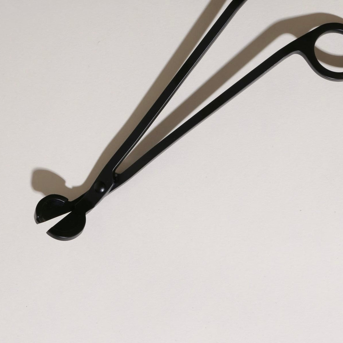 Black wick trimmer on a white background